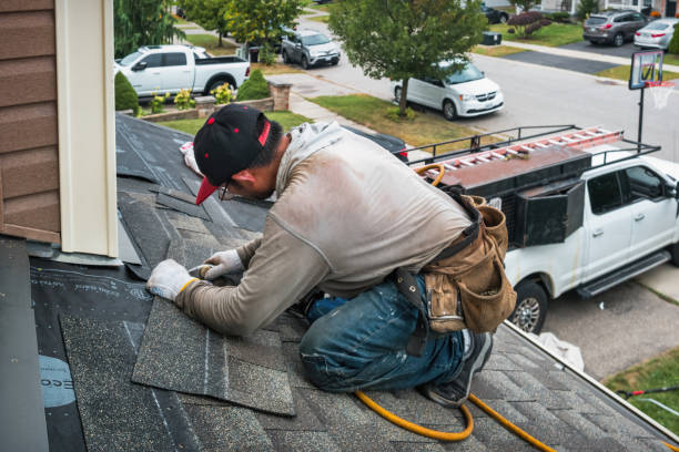 Professional Storm Damage Roof Repair technician working in Akron, IN